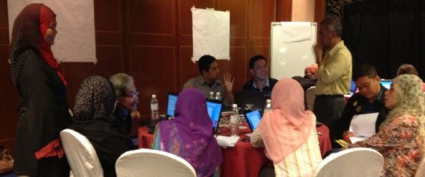 Participants and panel members deep in discussion at the research workshop, Avillion, Port Dickson, 2012