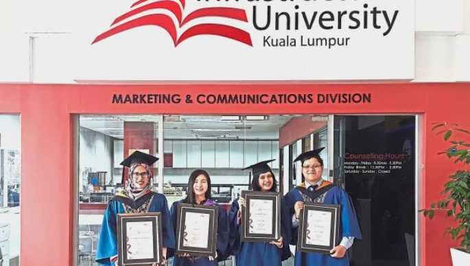 (From left) Fatin Nadhirah and Vice Chancellor’s Award recipients Law, Nurul Najihah and Wong after receiving their scrolls at the 16th IUKL convocation ceremony.